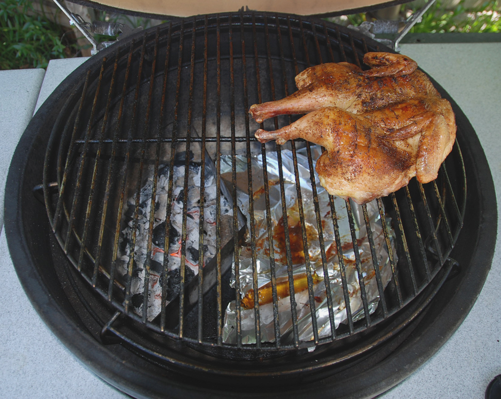 spatchock chicken over ang-l bracket in xl big green egg